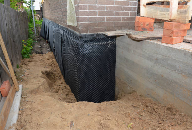 SJ Waterproofing Pros technician performing targeted Basement Waterproofing assessment in Rosedale, IN